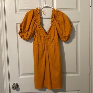 orange boutique dress NOT MATERNITY (not sure why it says that on size)